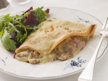 Savoury Pancake filled with Ham Cheese and Mushrooms with dresse clipart