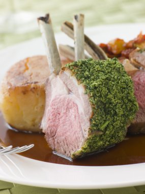 Rack of Lamb with a Herb Crust Potato Fondant and Ratatouille clipart