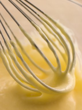 Hollandaise Sauce being whisked clipart