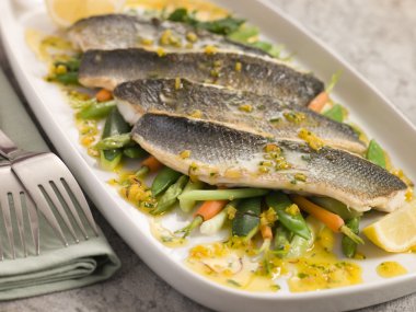 Fillets of Sea bass with Baby Vegetables and Saffron Butter clipart