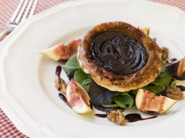 Red Onion Tarte Tatin with Walnuts Figs and Red Wine Syrup clipart