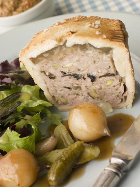 Pork Black Truffle and Pistachio Pie with Glazed Button Onions a clipart