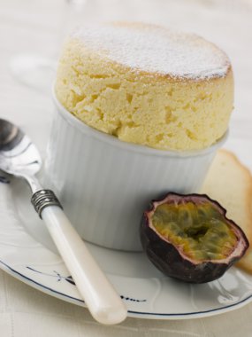 Hot Passion Fruit Souffle with Langue de Chat Biscuits clipart