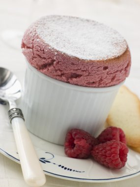 Hot Raspberry Souffle with Langue de Chat Biscuits clipart