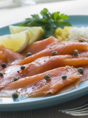 Scottish Smoked Salmon with Lemon Capers and Egg clipart