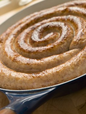 Cumberland Sausage Coil in a Frying Pan clipart