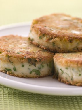 Plate of Bubble and Squeak cakes clipart