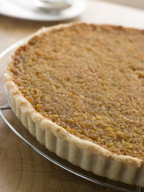 Whole Treacle Tart on a Cooling Rack clipart