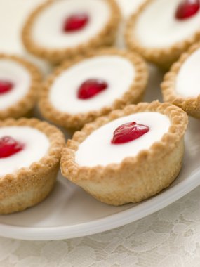 Plate of Cherry Bakewell Tarts clipart