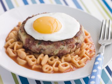 Corned Beef Hash Cake with Alphabet Pasta and a Fried Egg clipart