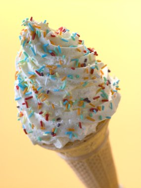 Whipped Ice Cream Cone with Candy Sprinkles clipart
