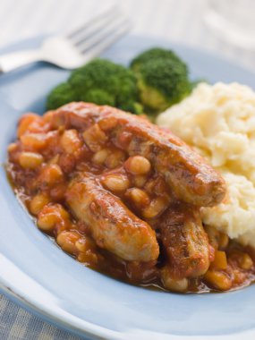 Sausage and Baked Bean Casserole with Mashed Potato and Broccoli clipart
