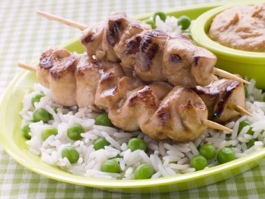 Chicken Satay Sticks with Peanut Butter Sauce and Fried Rice clipart