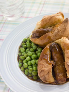 Individual Toad in the Holes with Gravy and Peas clipart