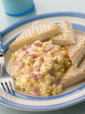 Cheesy Scrambled Egg with Ham and Toasted Triangles clipart