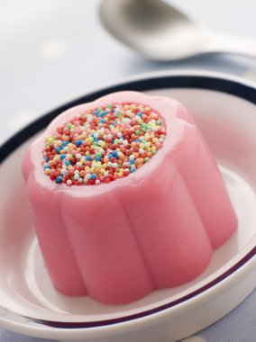 Blancmange topped with 100's and 1000's clipart
