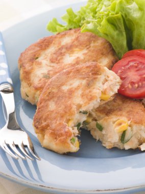 Cod and Salmon Fish Cakes with Corn and Salad clipart