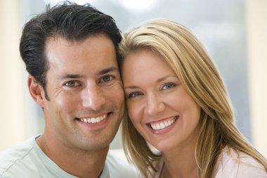 Couple indoors smiling clipart