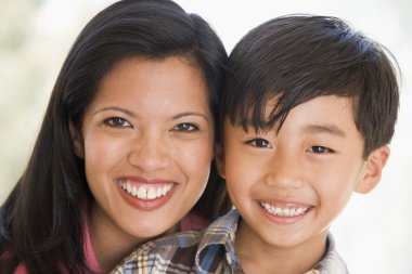 Woman and young boy smiling clipart