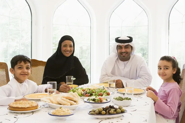 stock image A Middle Eastern family enjoying a meal in a restaurant