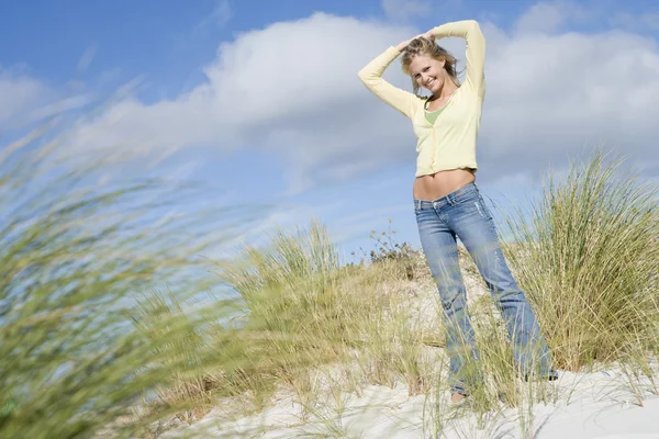 Young Woman Stretching Amongst Dunes — Stock Photo, Image