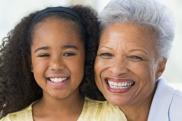 Grandmother and granddaughter smiling — Stock Photo, Image