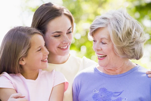 Grandmother with adult daughter and grandchild in park — Stock Photo, Image