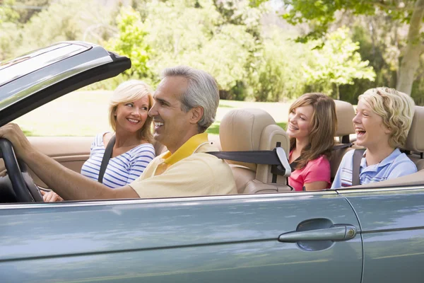 Family in convertible car smiling — Stock Photo, Image