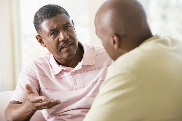 Two men in living room talking — Stock Photo, Image
