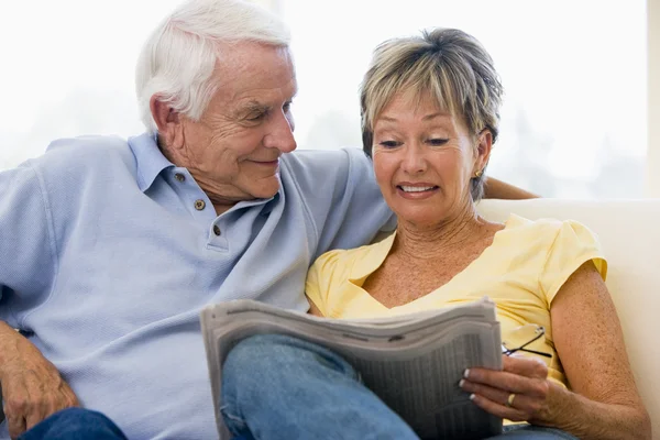 Couple Living Room Reading Newspaper Smiling — Stock Photo, Image