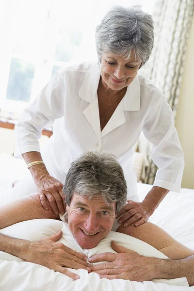Woman Giving Man Massage Bedroom Smiling — Stock Photo, Image