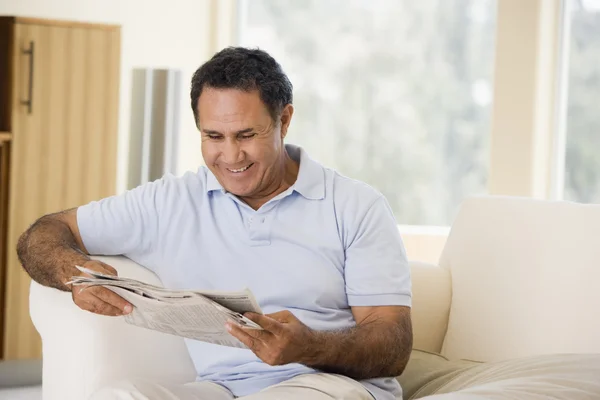 Man Relaxing Newspaper Living Room Smiling — Stock Photo, Image