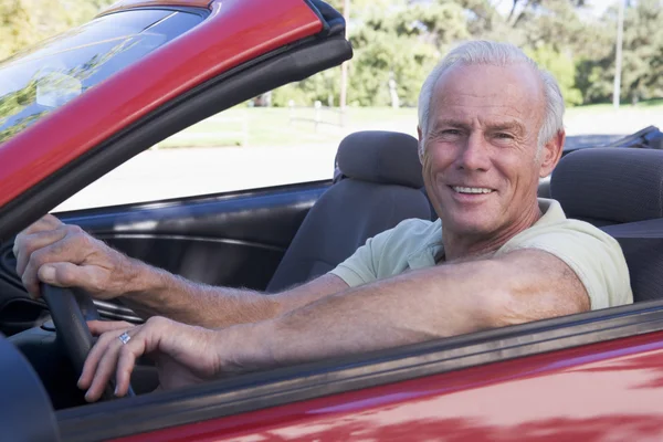 Man in convertible car smiling — Stock Photo, Image