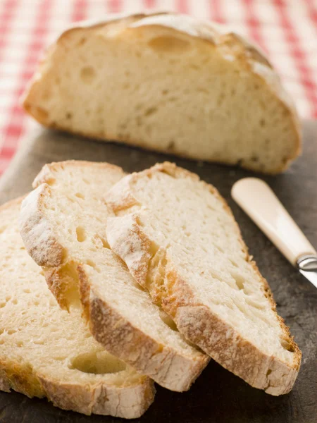 Loaf and Slices of American Sour Dough Bread — Stock Photo, Image