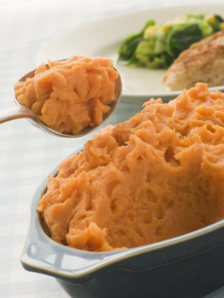 Dish of Sweet Potato Mash with a spoon — Stock Photo, Image