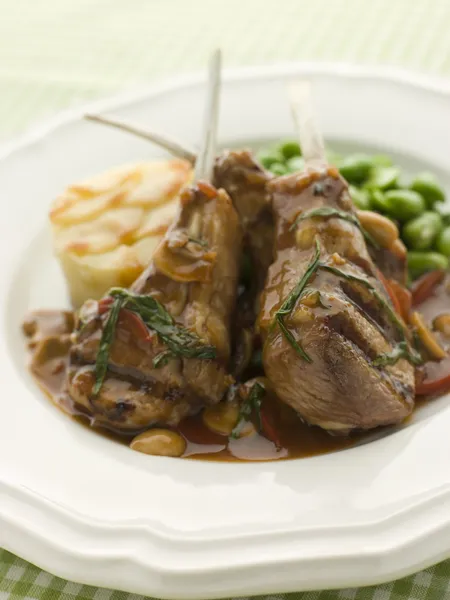 Grilled Lamb Cutlets Chasseur sauce Pomme Anna and Baby Broad be — Stock Photo, Image