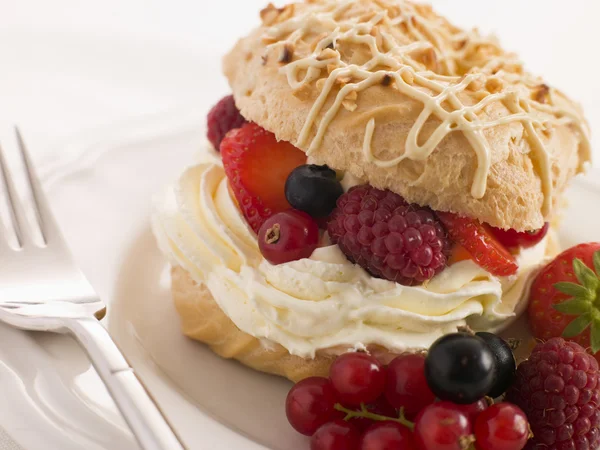 Choux Bun filled with Mixed Berries and Chantilly Cream — Stock Photo, Image