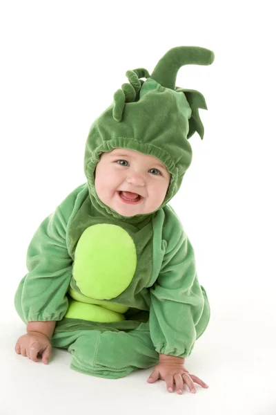 Bebê em ervilhas no traje de vagem sorrindo — Fotografia de Stock