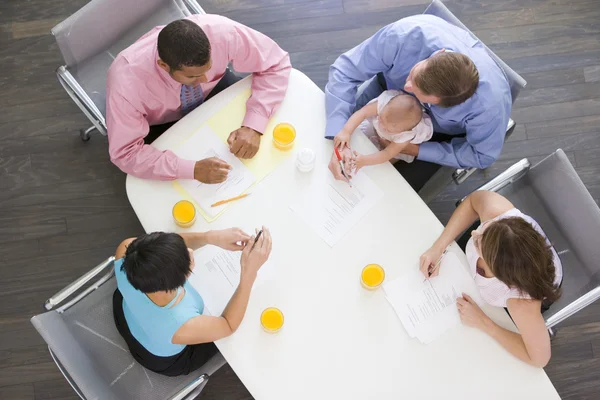 Four Businesspeople Boardroom One Holding Baby — Stock Photo, Image