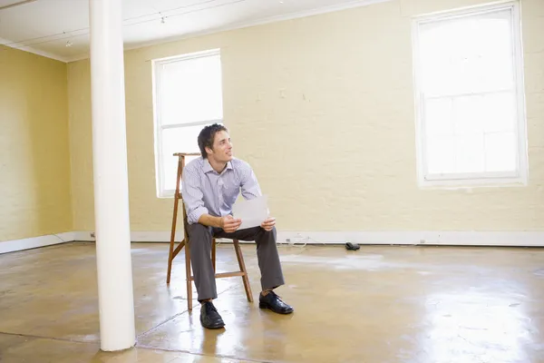 Man Sitting Ladder Empty Space Holding Paper — Stock Photo, Image