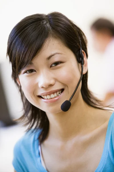 Woman Wearing Headset Indoors Smiling — Stockfoto