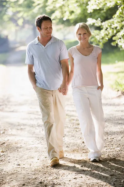 Couple Walking Outdoors Holding Hands Smiling — Stock Photo, Image