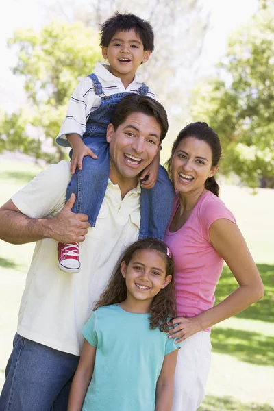 Family outdoors smiling — Stock Photo, Image