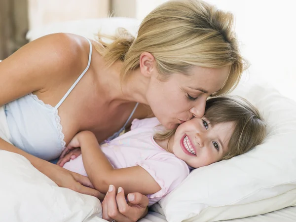 Woman Kissing Young Girl Bed Smiling — Stock Photo, Image