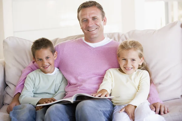 Man Two Children Sitting Living Room Reading Book Smi — Stock Photo, Image