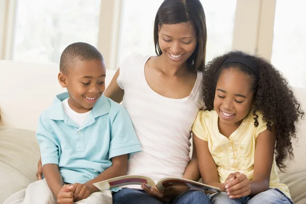 Woman Two Children Sitting Living Room Reading Book — Stock Photo, Image