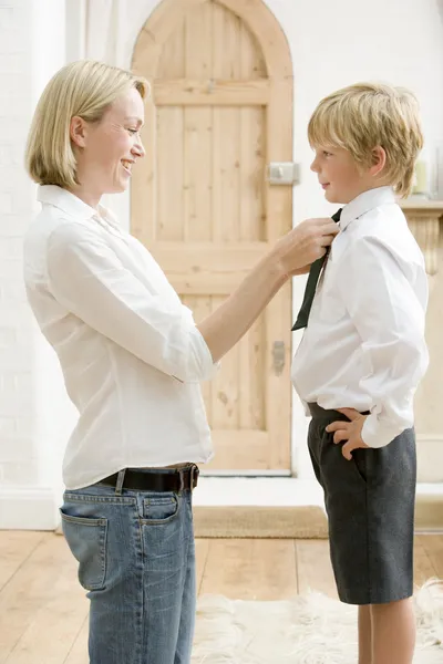 Woman Front Hallway Fixing Young Boy Tie Smiling — Stock Photo, Image