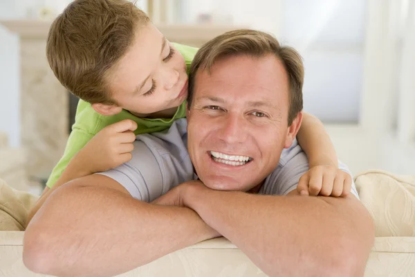 Young Boy Kissing Smiling Man Living Room — Stock Photo, Image