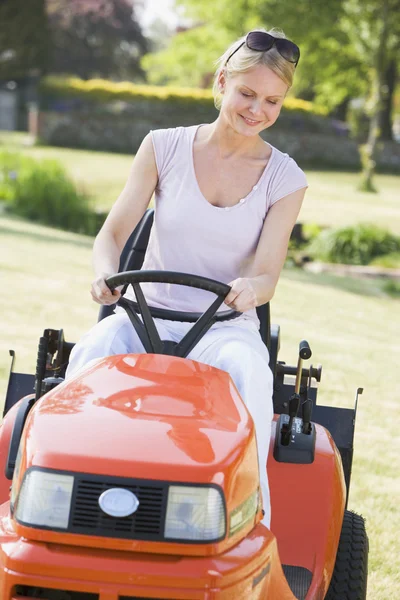 Woman Outdoors Driving Lawnmower Smiling — Stock Photo, Image