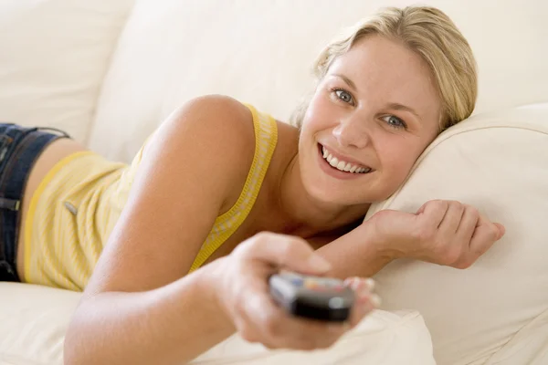 Woman Living Room Holding Remote Control Smiling — Stock Photo, Image